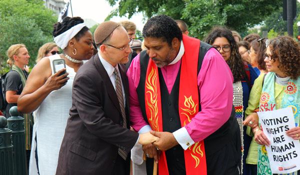Rabbi Jason Kimelman-Block and Rev. Dr. William Barber march in front of the Supreme Court