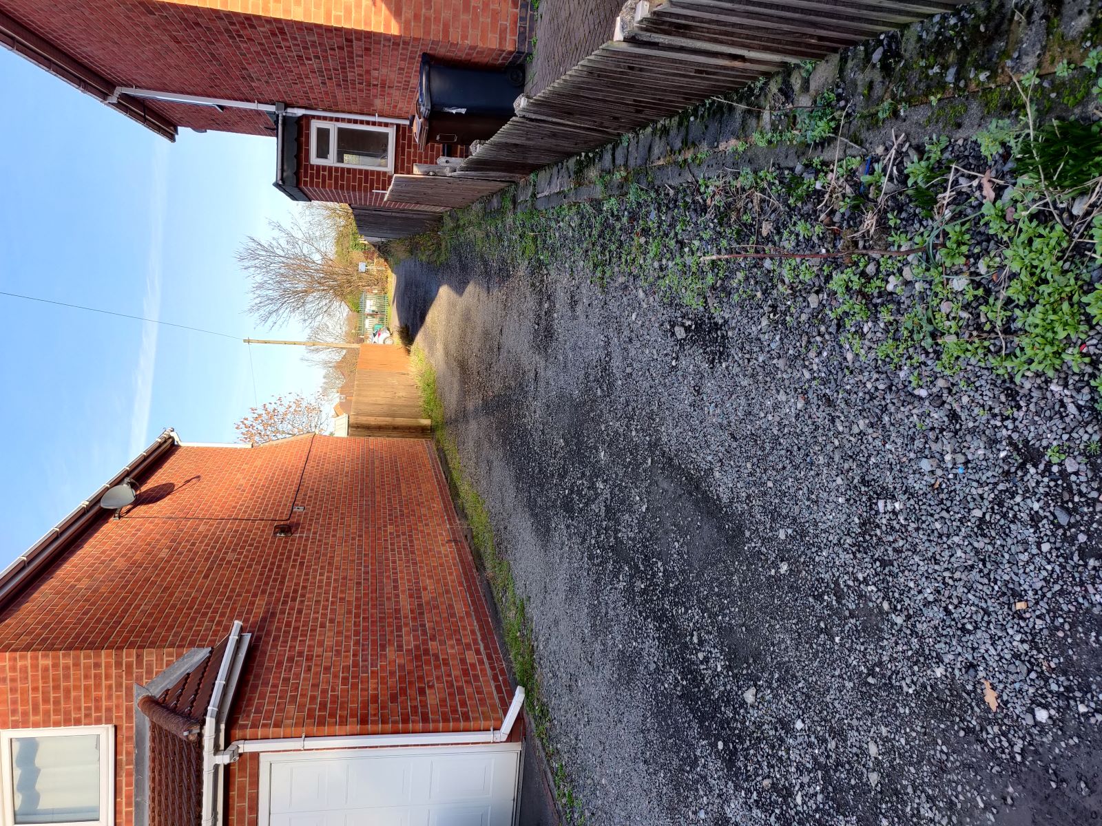 Install a gate and light source on the land between 6365 Scott Road