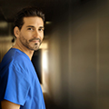male nurse against a wall