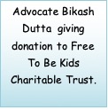 Text Box: Advocate Bikash Dutta giving donation to Free To Be Kids Charitable Trust.