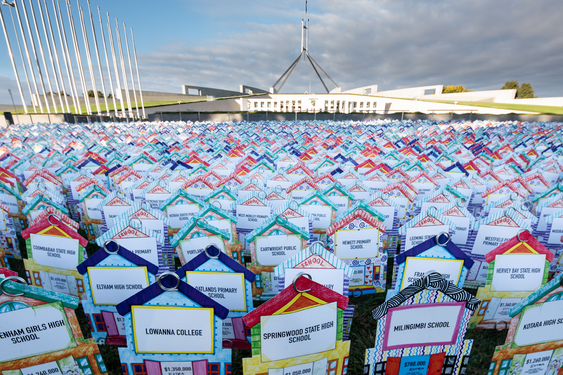 Thousands of public schools displayed outside Parliament in fight against funding cuts