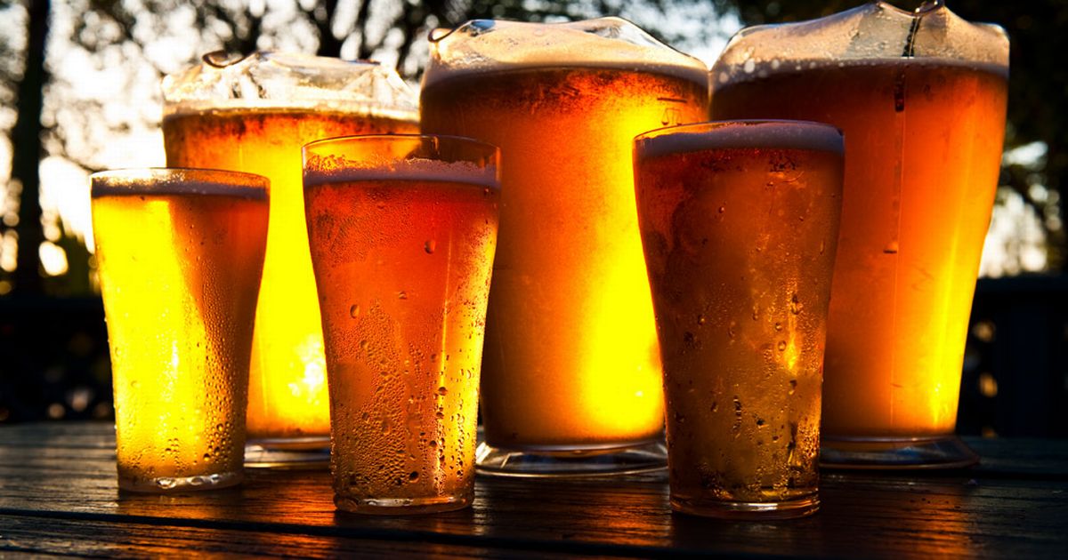 Pitchers_and_pints_of_cold_beer_seen_on_a_bar.jpg