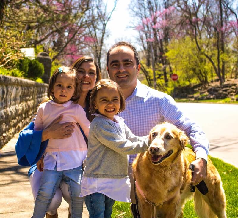 Dr. Adil Baguirov with wife, children and dog Adil Baguirov with family and golden retriever