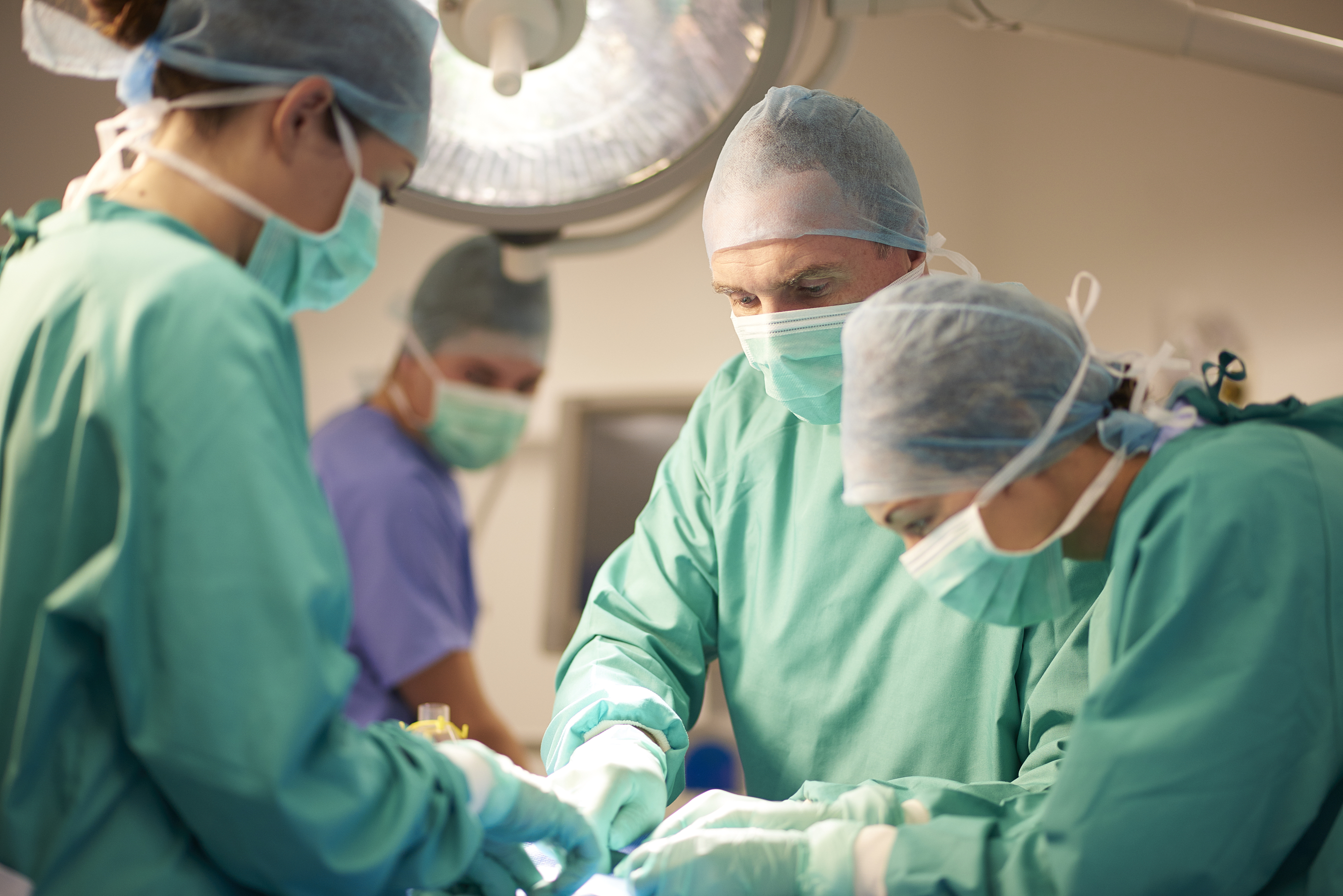 We need
public solutions to wait times Surgeons in an operating room