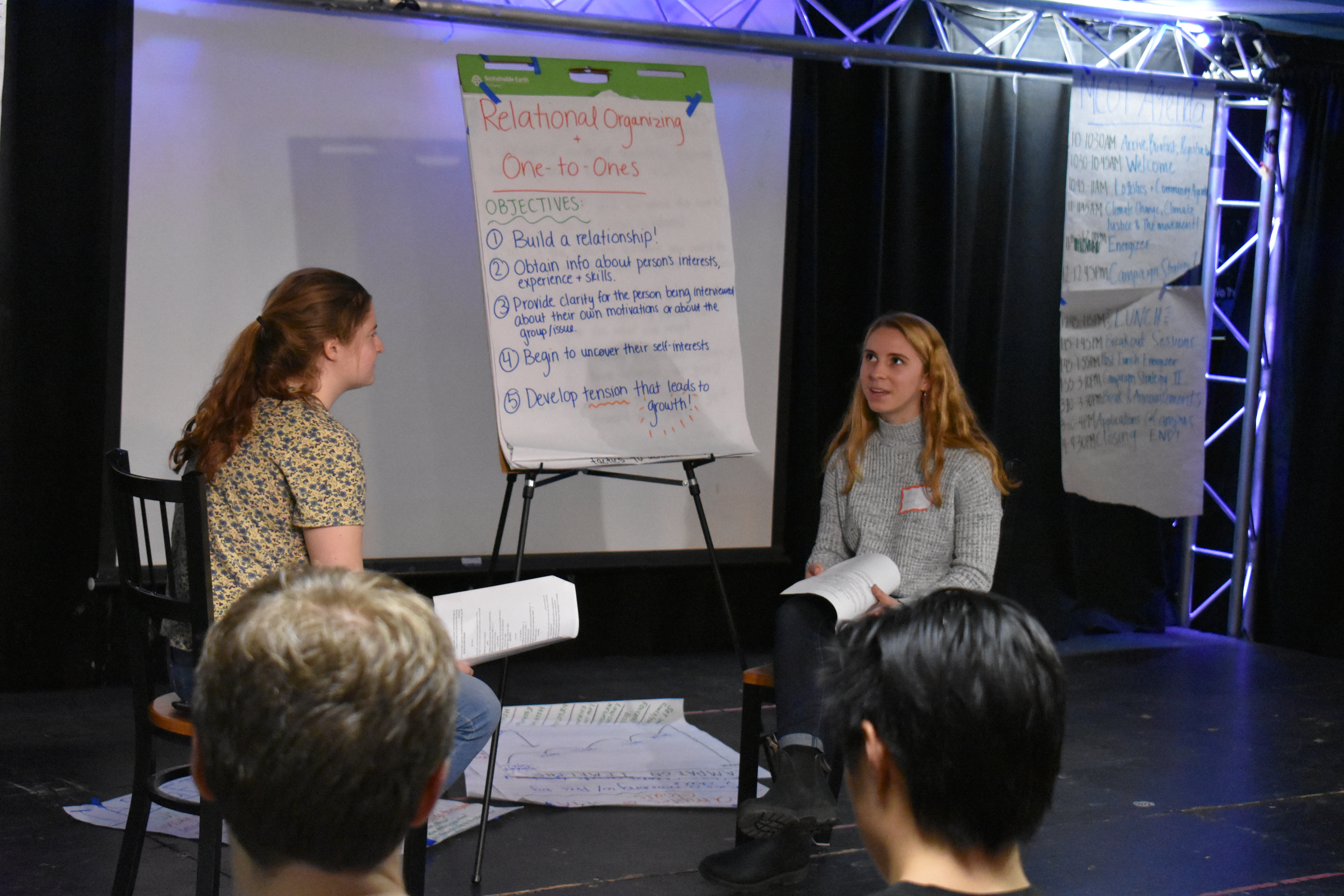Fellows Laddy DeLuca Lowell (left) and Celia Bottger (right) demonstrate the importance of relational organizing by roleplaying a one-to-one conversation.