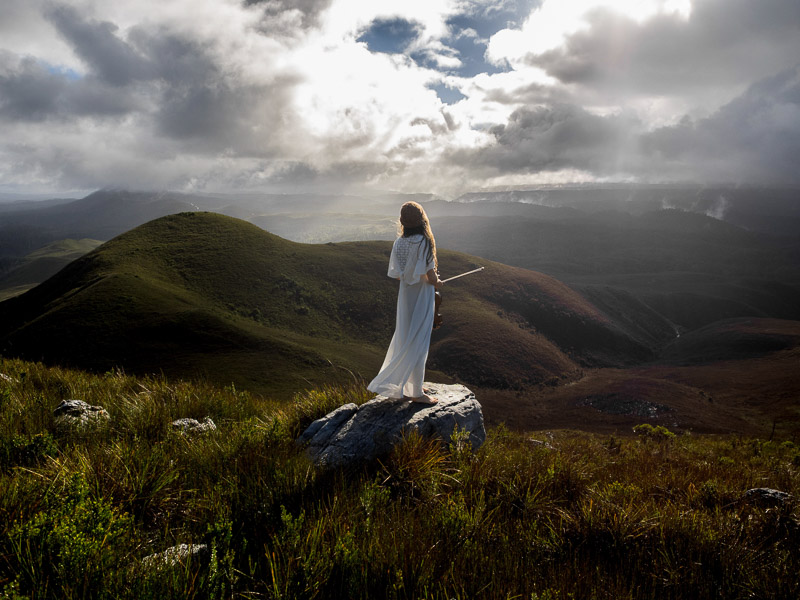 Full_Image_Jessie_Westbury_with_her_violin-_standing_on_Mt_Donaldson-_as_captured_by_Andy_Szollosi.jpg