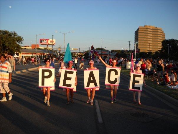 July 4, Auditorium Shores, Austin -- Five CODEPINK Austin women gathered at the symphony-and-fireworks festivities to display a freedom message of our own: PEACE -- and what peace means. The back of the signs read, Peace is Freedom from War, Peace Takes Courage, Peace is Creative, Peace is Healthy, and Peace is Matriotic.