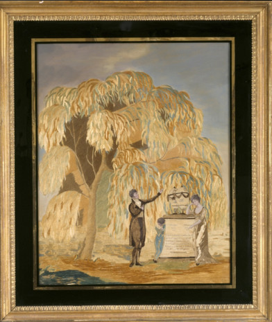image of couple standing by gravestone under tree