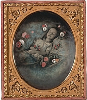 image of girl on deathbed surrounded by flowers
