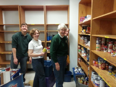 members working during a service project at a food pantry