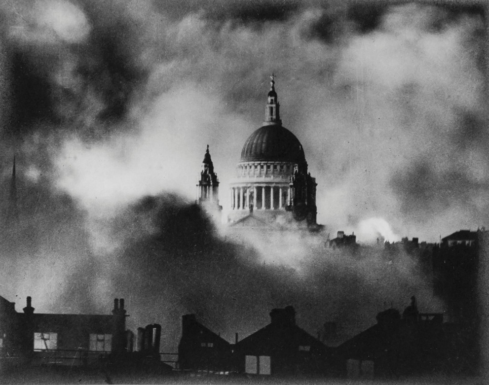 dome of Saint Paul's Catherdral visible above smoke and rubble