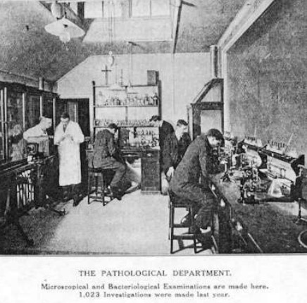 photo of workers with microscopes for pathology and bacterialogical exams