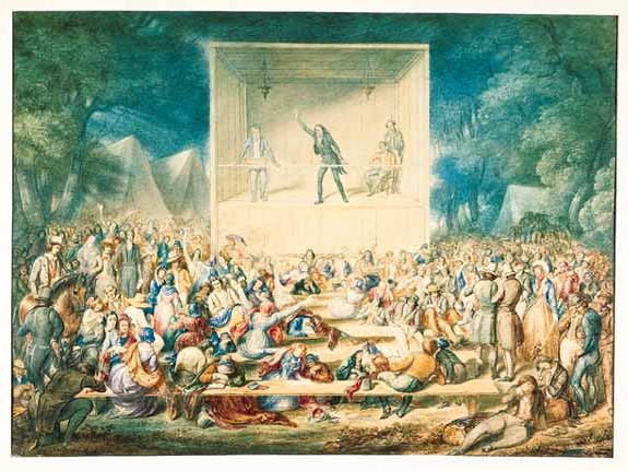 image of preacher on outdoor stage