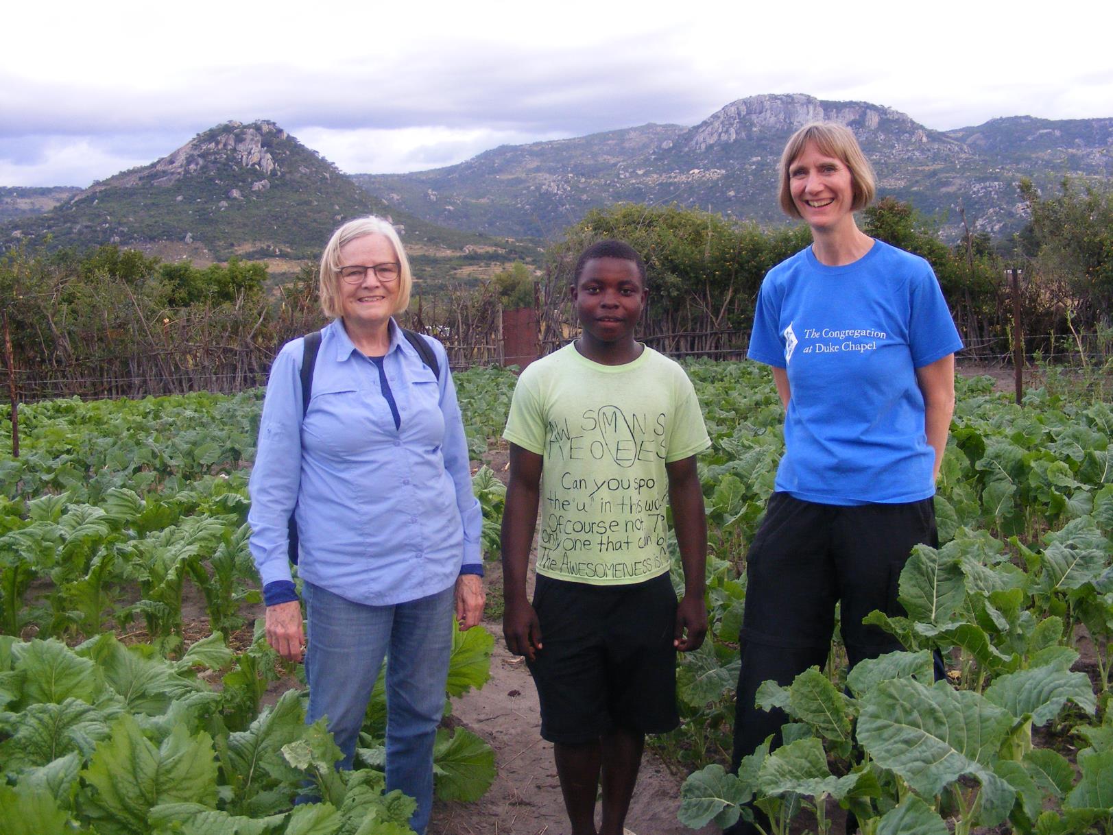 photo of teenager in his garden with Jand and Carol