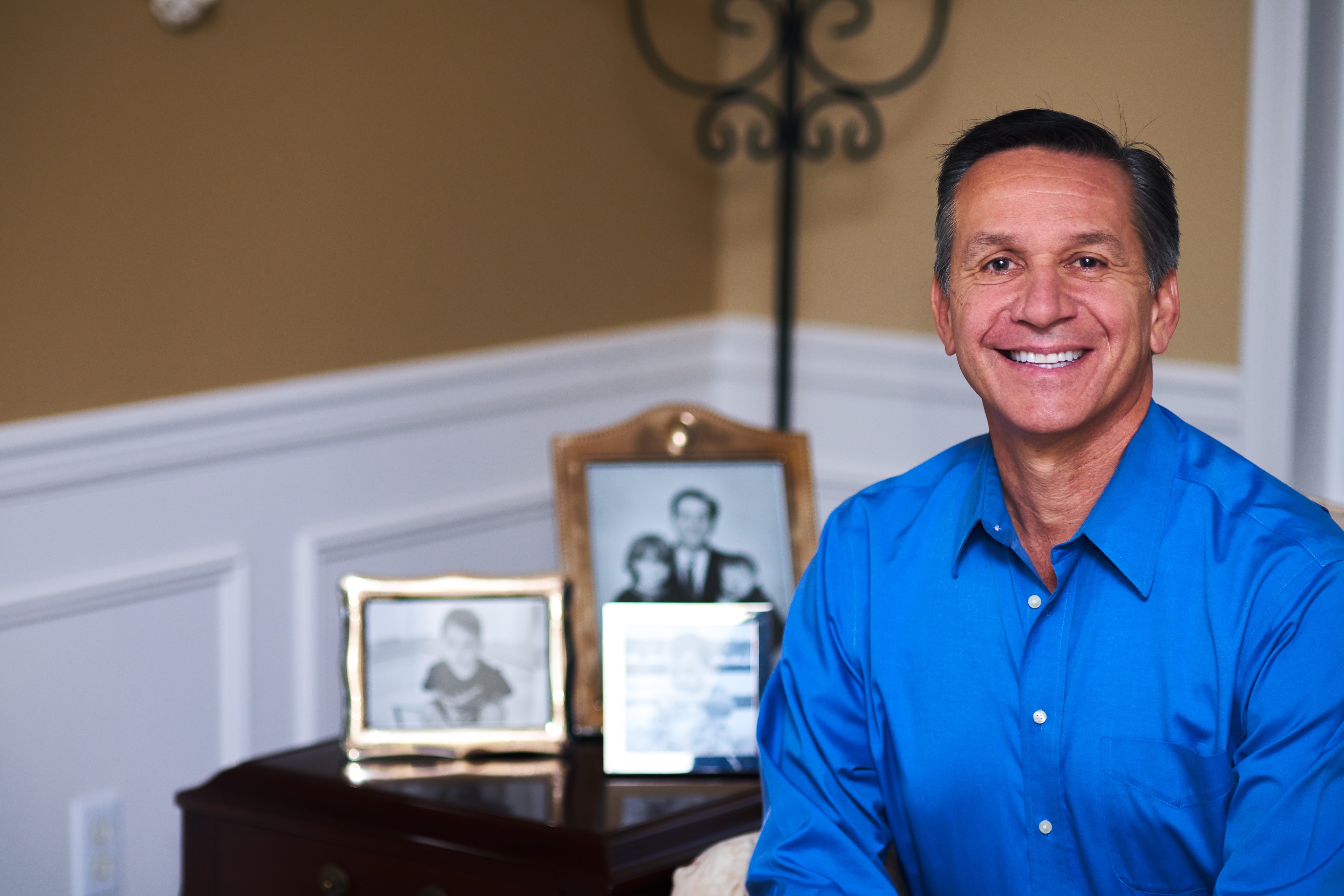 Dino_with_Fam_Photos_in_Background_(1)-min_(1).jpg