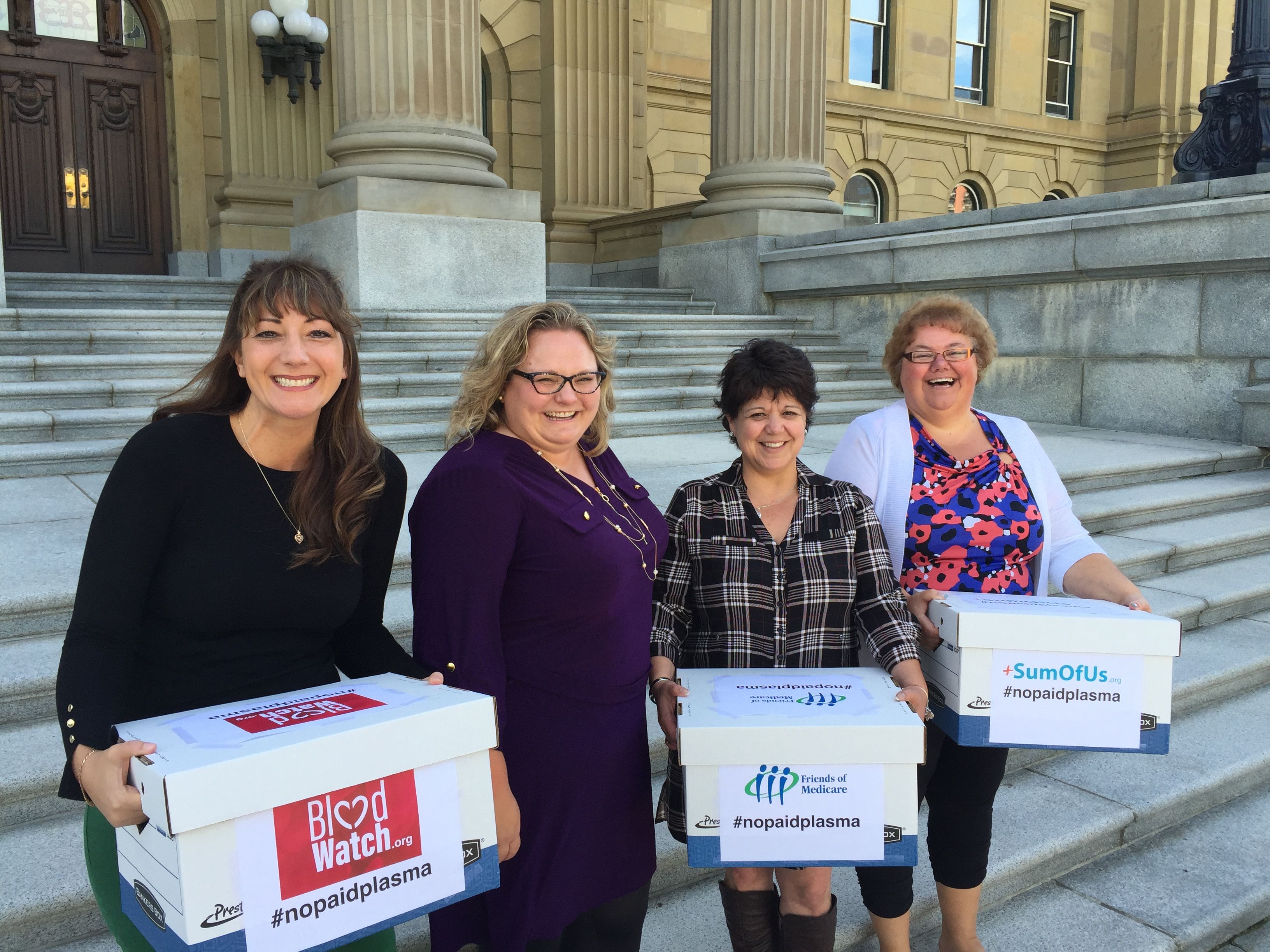 Sandra Azocar, Kat Lanteigne with BloodWatch.org & CUPE Alberta President Marle Roberts presenting petitions to Minister Hoffman calling to ban the sale of plasma.