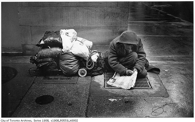 Apparently_homeless_man_doing_crossword.jpg