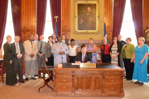 AMOS - Governor Signing Photo of AMOS leaders at Governor's Signing of $100K for Project Iowa