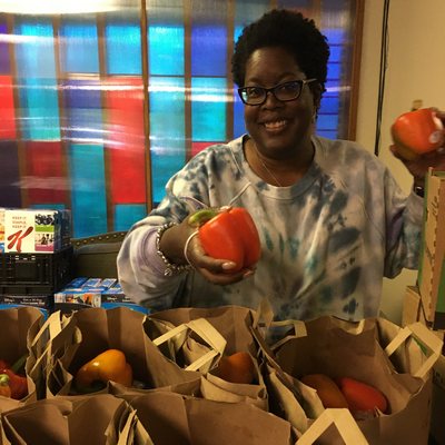 Janet preps peppers for food boxes