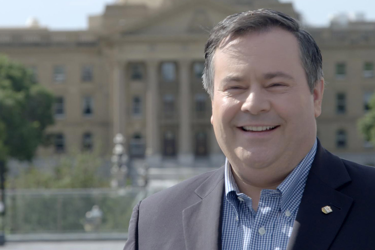 Jason Kenney in front of Alberta legislature