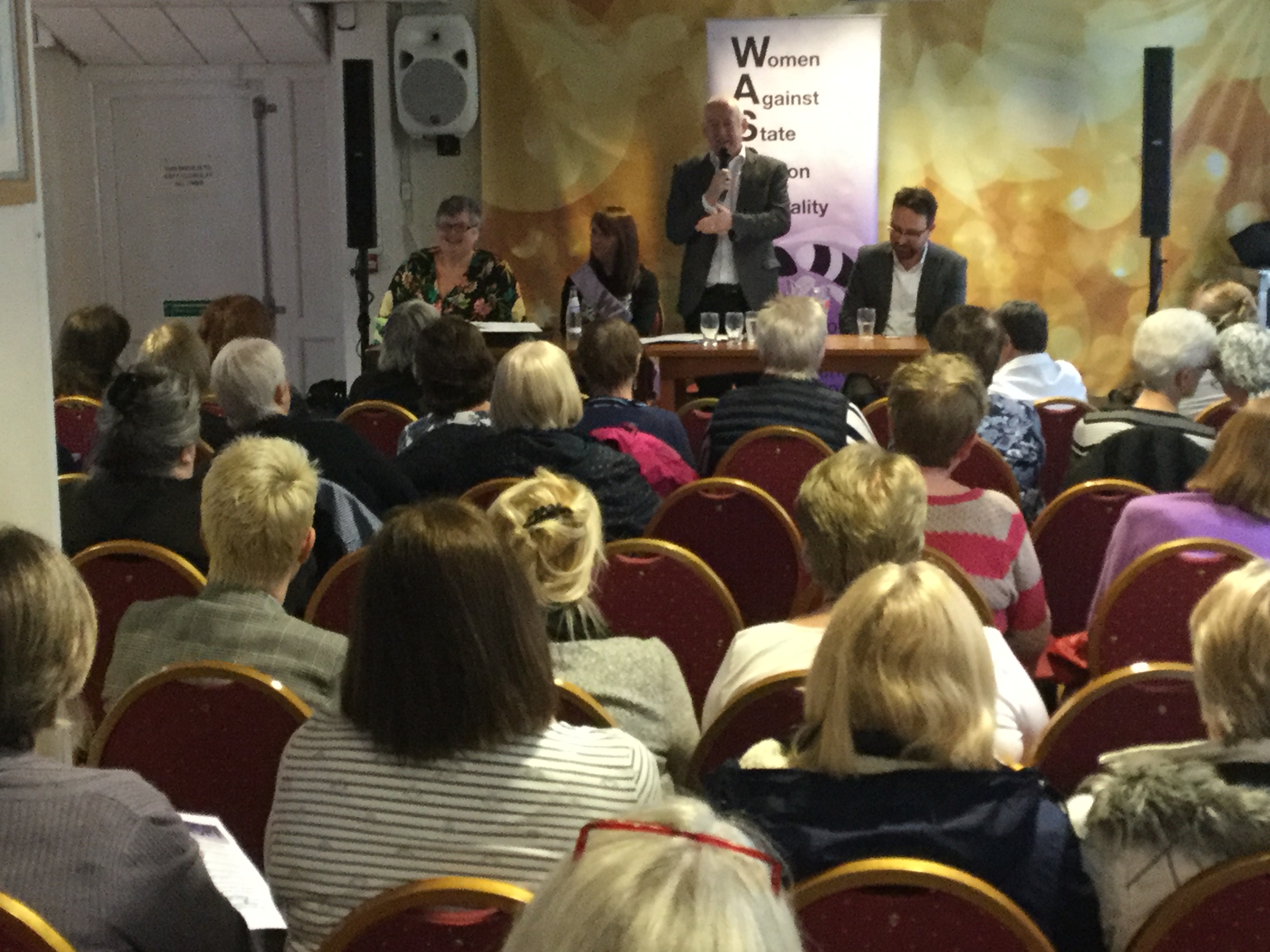 WASPI meeting Carolyn Harris, Sue Jarman, Wayne David and Hefin David address a meeting about state pension inequality