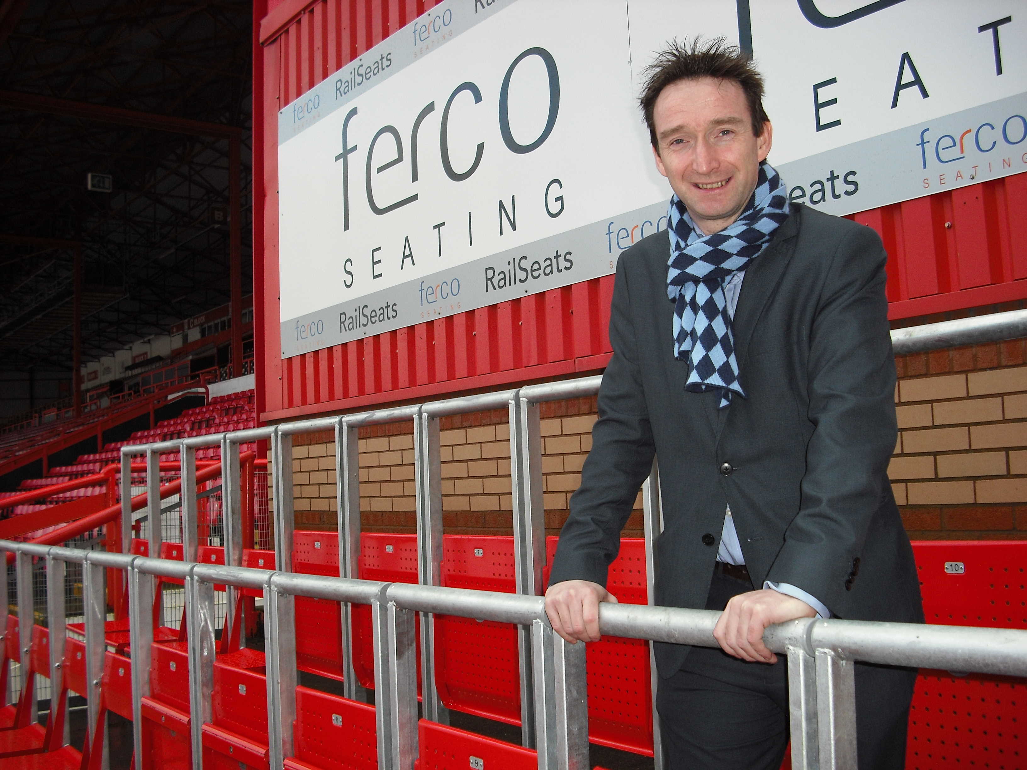 John_Leech_standing_at_rail_seats_1.jpg