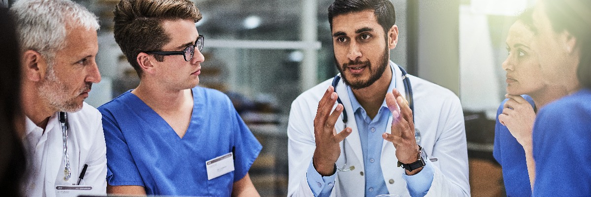 Six medics in discussion.