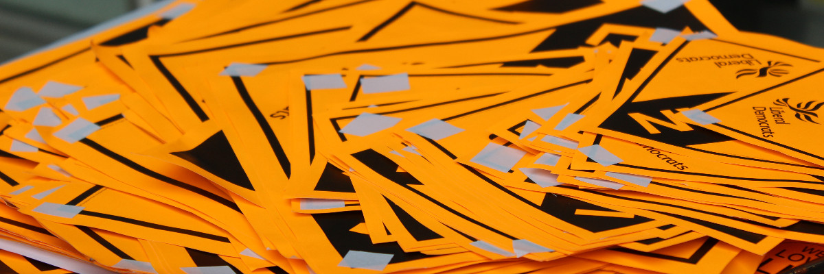 A pile of Liberal Democrat posters. Window posters mind. Not the really good ones.