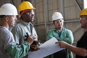 Multi-ethnic workers discussing plans.