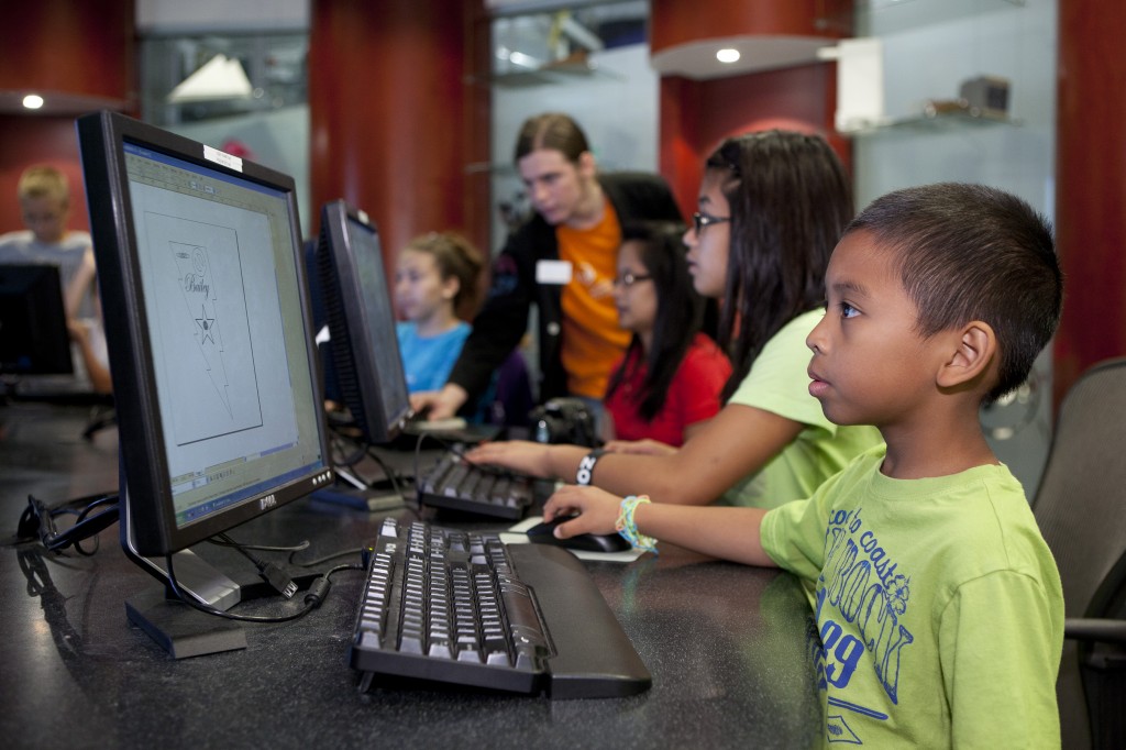 Children use CAD software to design their own keychains, which are then created on a laser cutter in MSI’s Fab Lab.