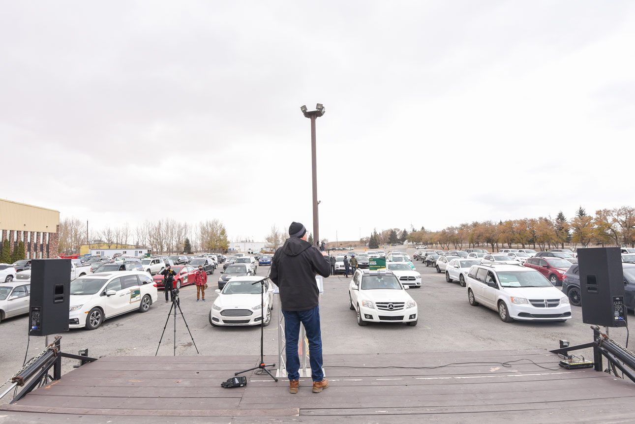 Premier Addresses Supporters in Their Cars at
