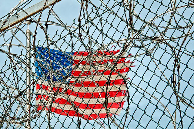 flag_in_barbed_wire.jpg