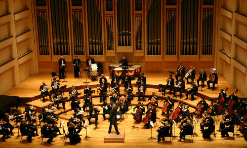An orchestra playing on a stage