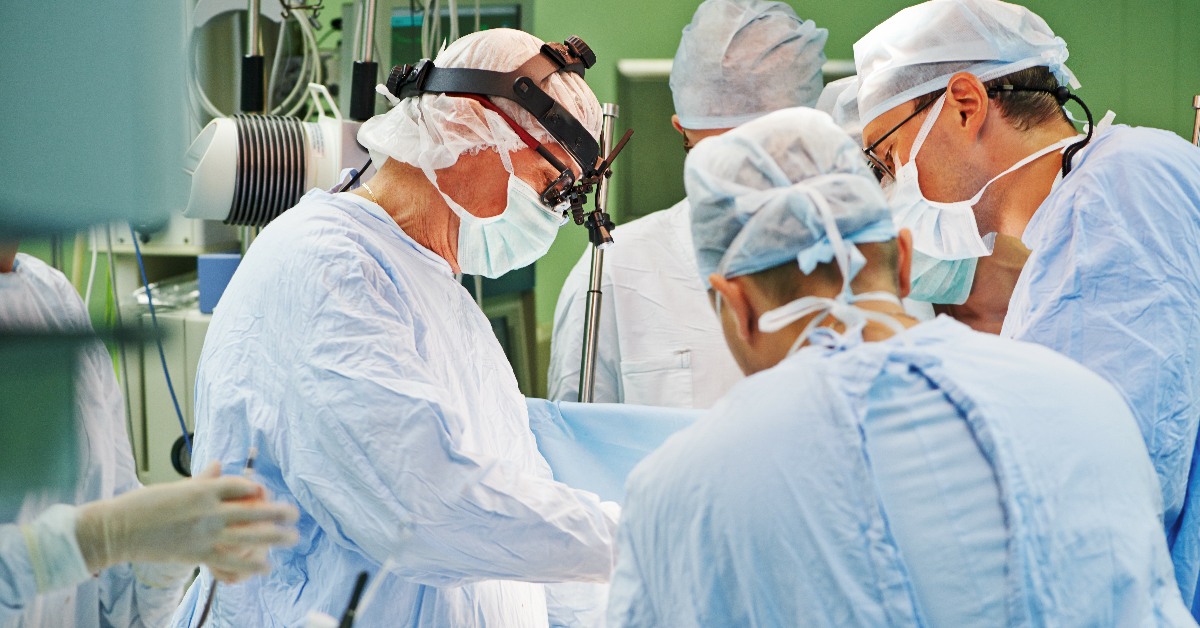 Surgeons operating in theatre.