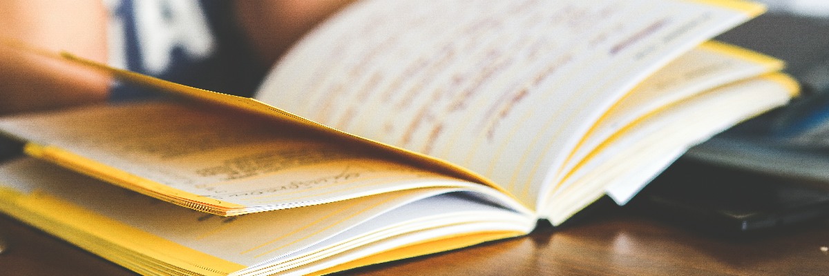 A notebook open on a desk.