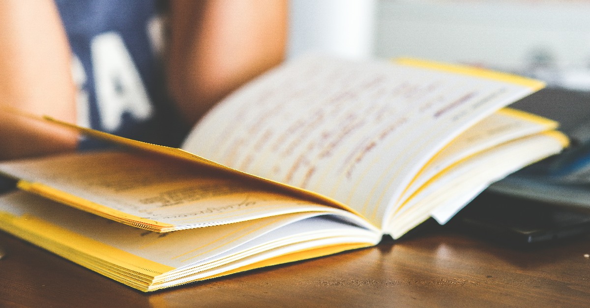 A notebook open on a desk.