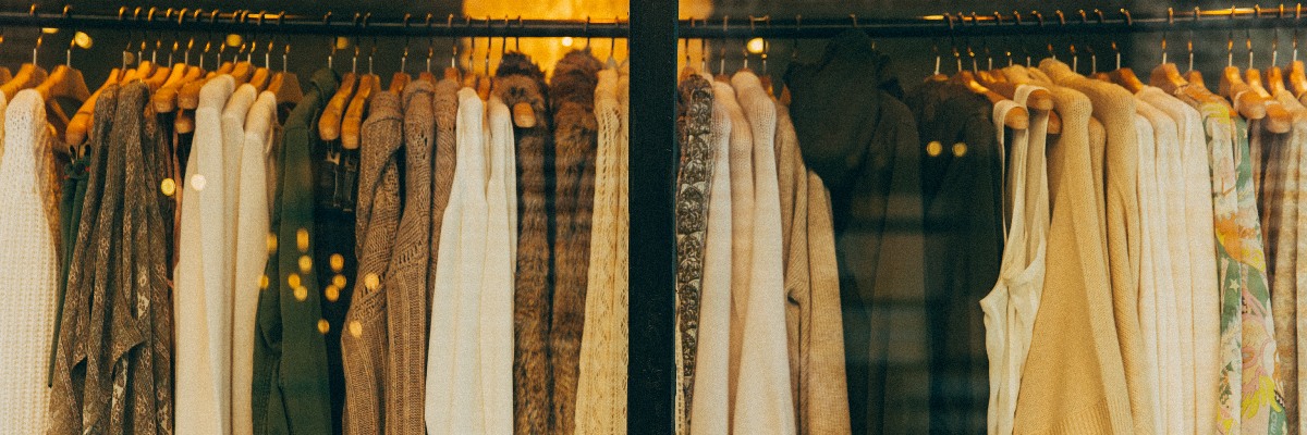 Rack of clothes in a shop window.