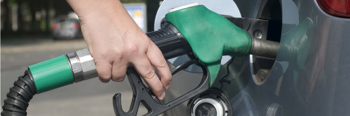 Car being filled with fuel.