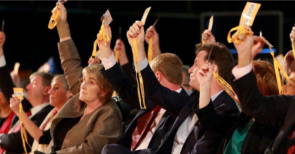 Lib Dem conference delegates voting.