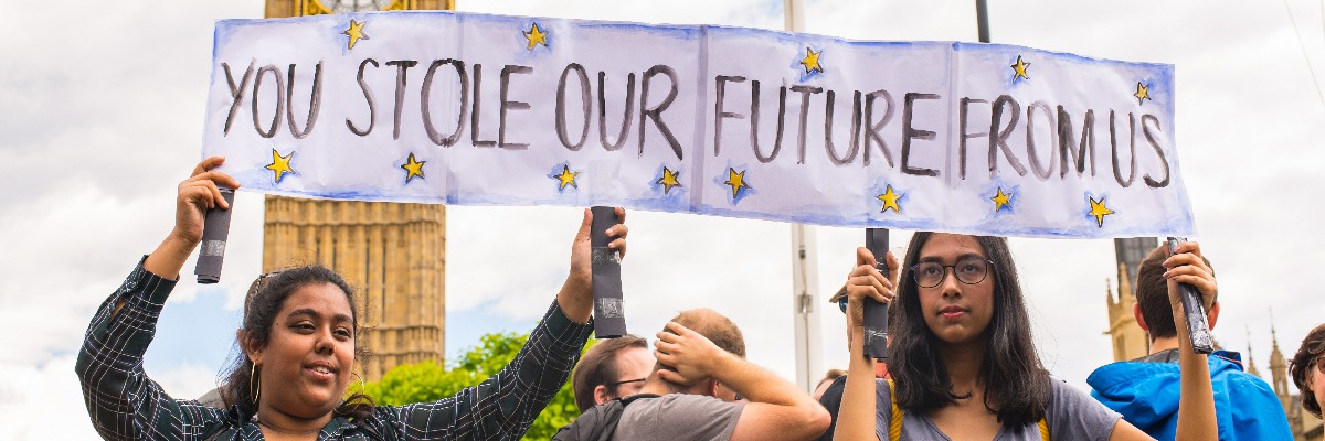 Young women holding a sign reading You Stole Our Future From Us at an ant-Brexit march