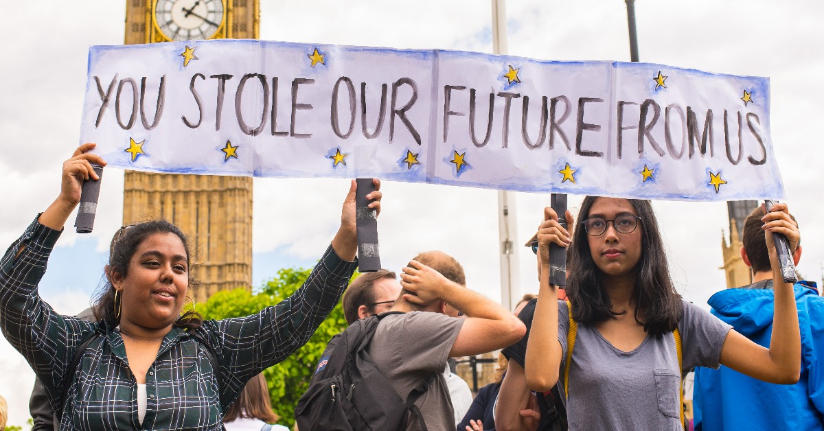 Young women holding a sign reading You Stole Our Future From Us at an ant-Brexit march