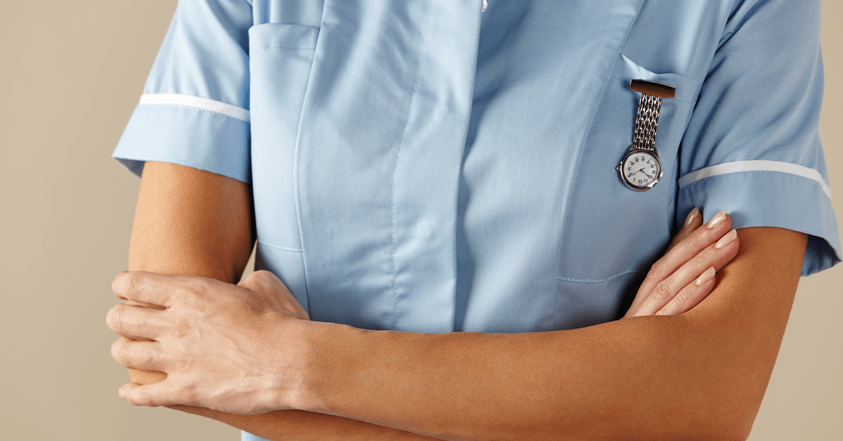 Upper body of nurse with arms crossed