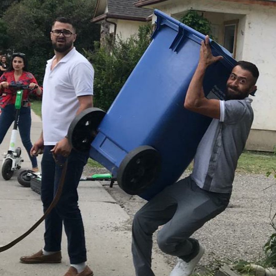 Ahmed Borhot wielding a belt and stone while his brother prepares to launch his “shield”