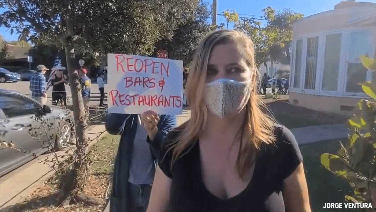 Protesters gather outside home of LA official caught outdoor dining hours after banning the activity