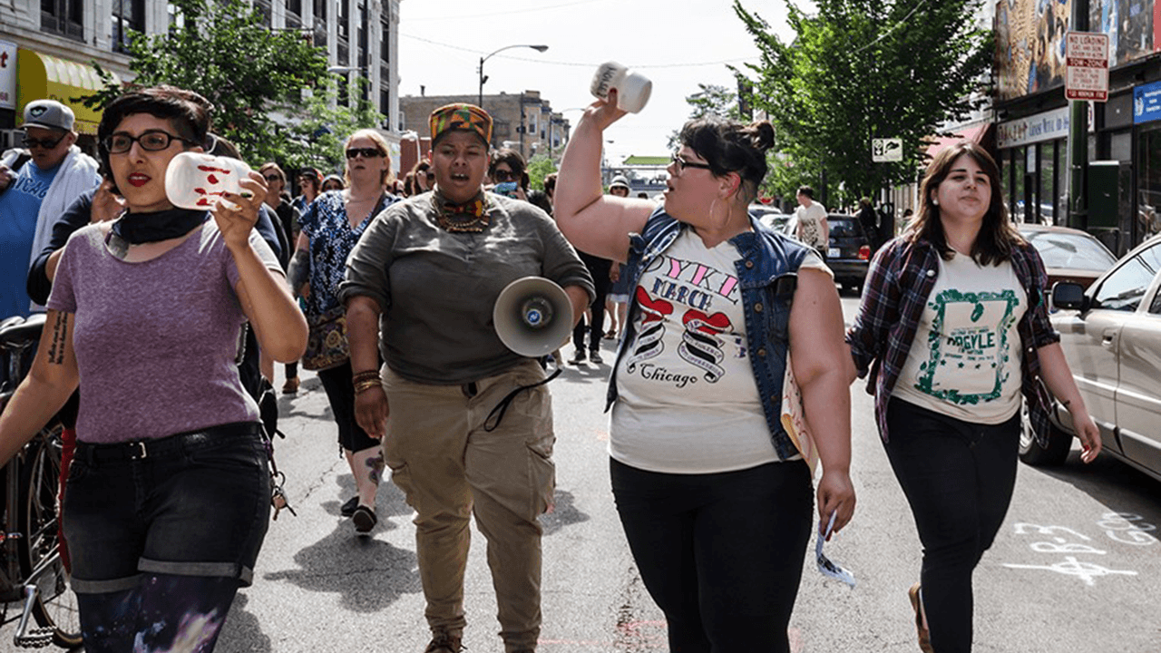Poster for annual Chicago Dyke March features burning American and Israeli flags
