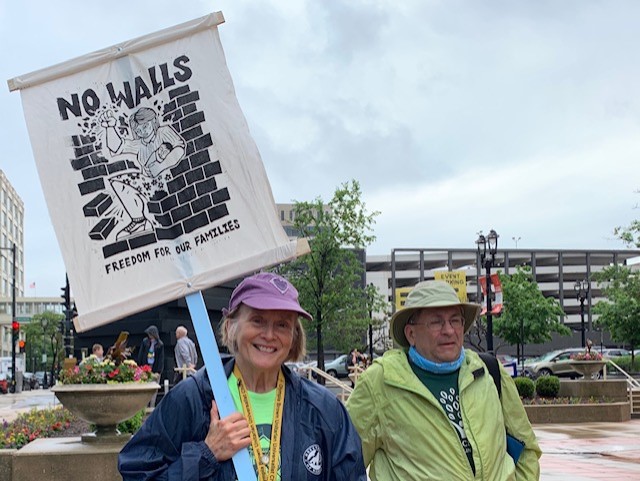 United Church of Christ members take part in a June 24 immigration demonstration in Milwaukee during the denomination's General Synod. WallsSign.jpg