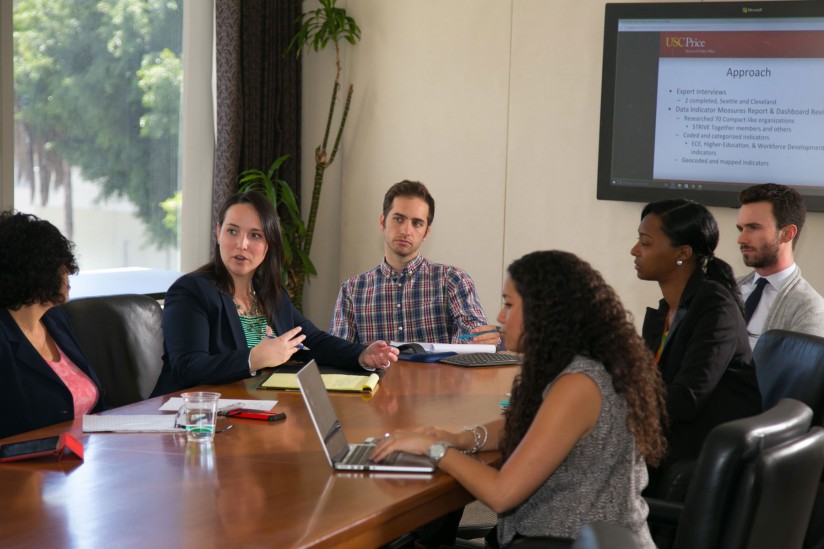 USC MPP students Jeanette Borden, Avery Seretan, Shinquell Green and Christopher Records present research project findings to the L.A. Compact Data Workgroup. (Photo/Tom Queally)