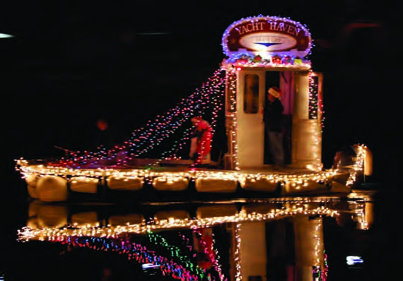 Participating in a lighted boat parade is a great way to wrap up the boating season and start the holiday season. © Sharon Benton lighted_parade_boat.jpg