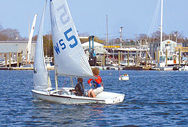 Williams School sailors Dan Nickerson (red rashguard) and Ben Gibson sharpen their boathandling by sailing ruderless during a practice session. (Photo - Clemmie Everett) Williams School sailors Dan Nickerson (red rashguard) and Ben Gibson sharpen their boathandling by sailing ruderless during a practice session. (Photo - Clemmie Everett)