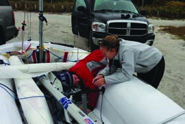 The author (red jacket) and Haley spent much of Christmas Day replacing their boat’s centerboard gasket. © Michael Rudnick The author (red jacket) and Haley spent much of Christmas Day replacing their boat’s centerboard gasket. © Michael Rudnick